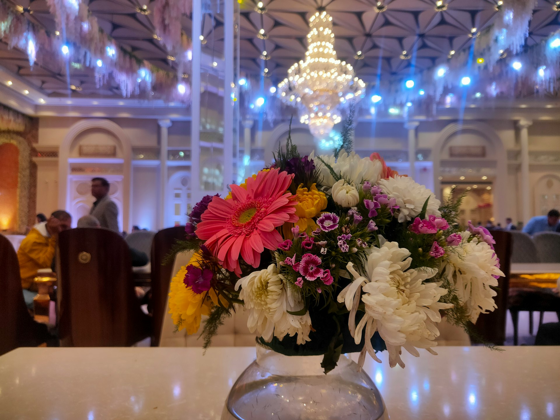 a vase filled with flowers sitting on top of a table